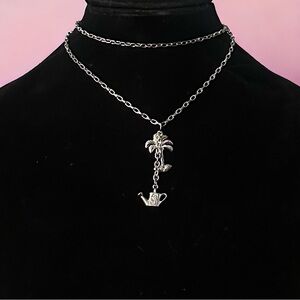 Bijoux Stella palm tree and watering can pendant necklace